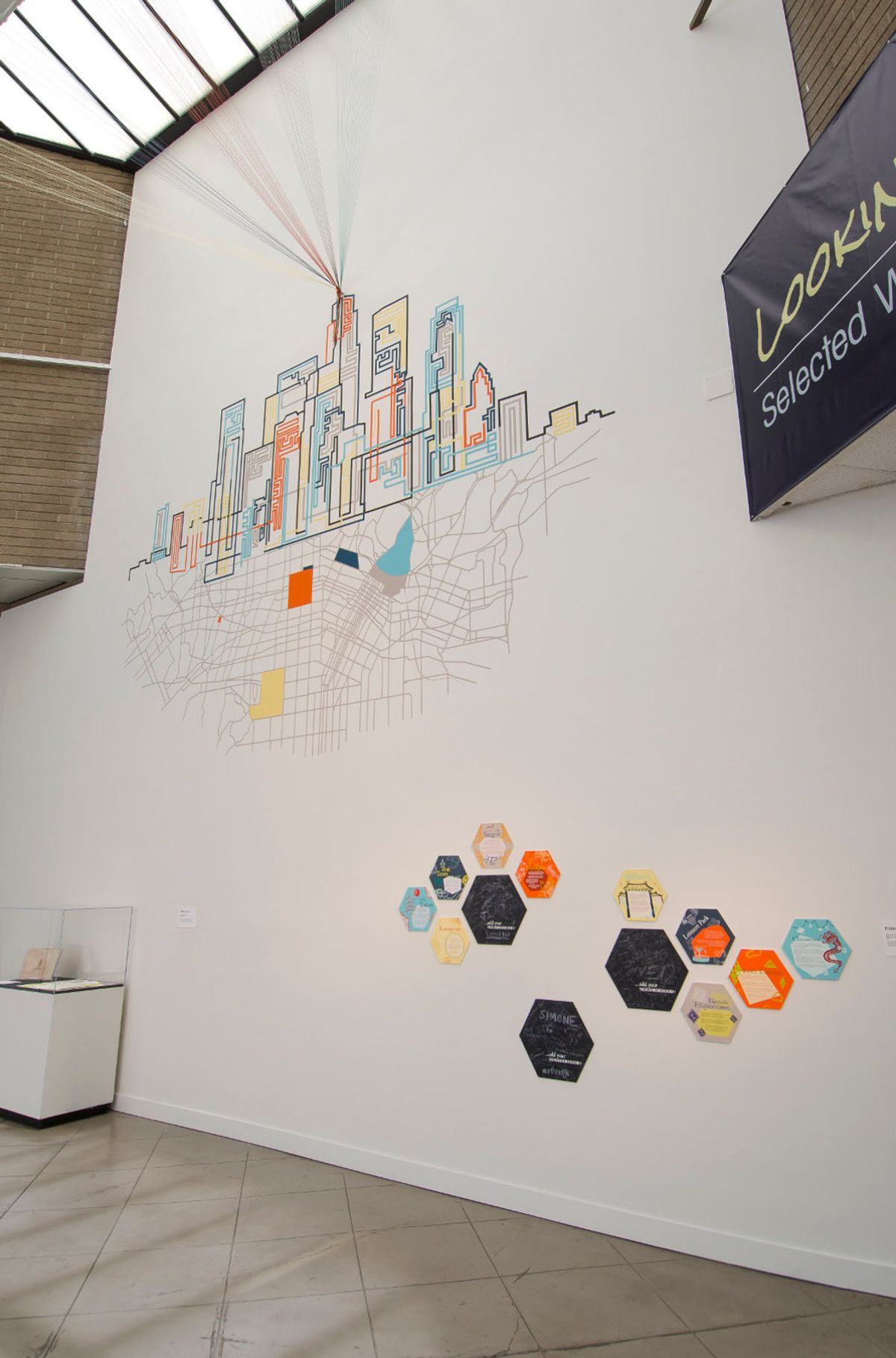 Artworks build on the wall, one included multicolor fiberwork