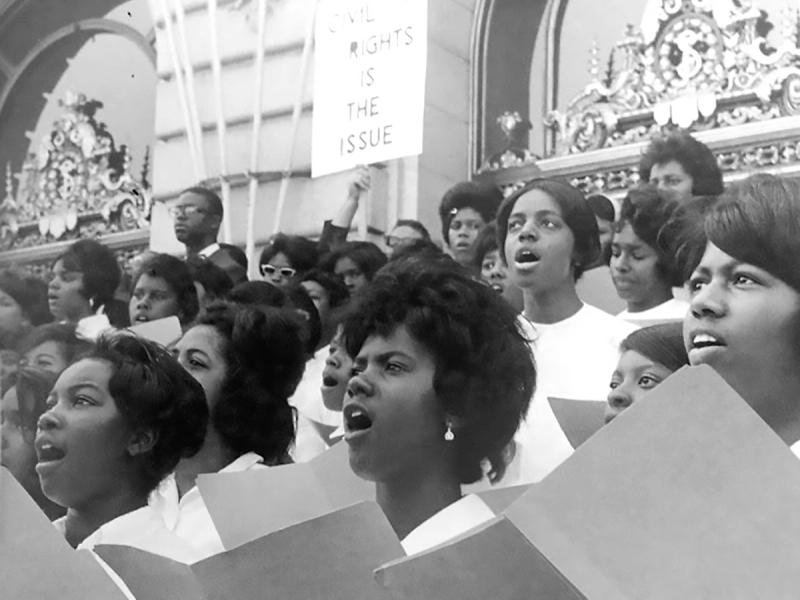 Choir singing in front of government building