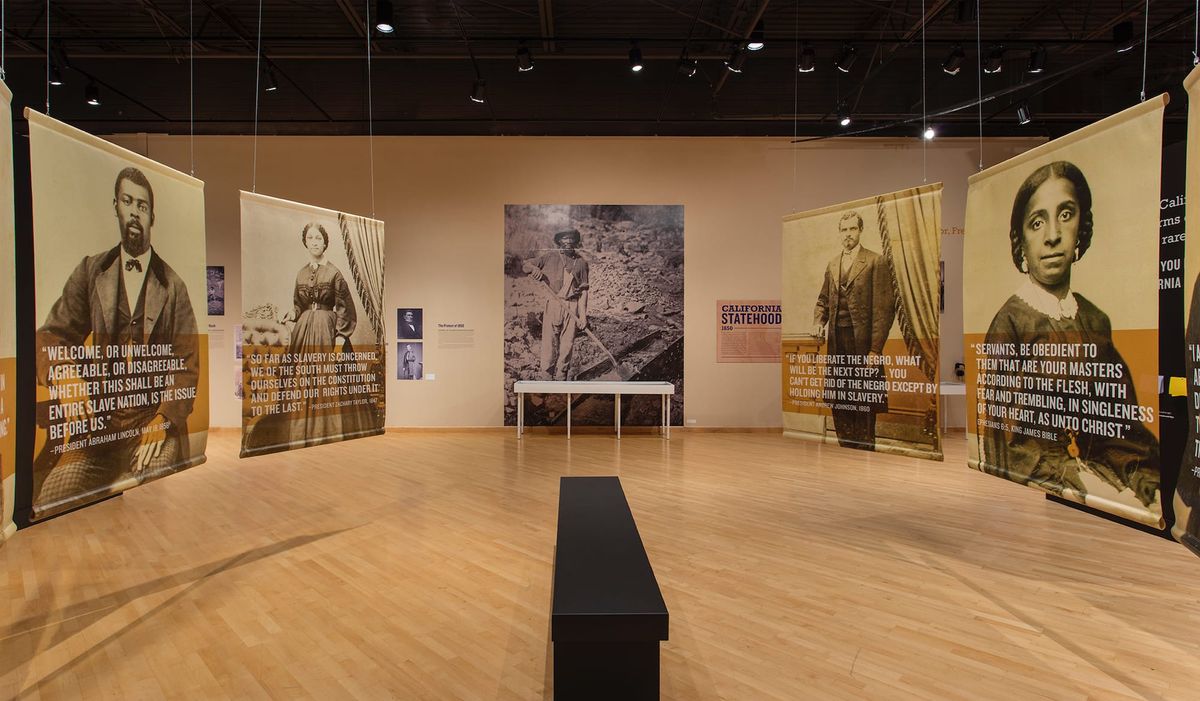 Installation view of large scale images of freedmen and freedwomen