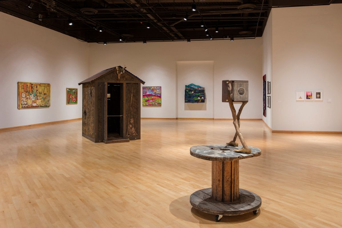 Installation view of sculptures and artworks on walls