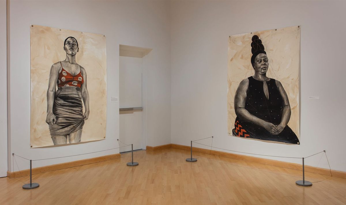 Installation view of two large scale portraits