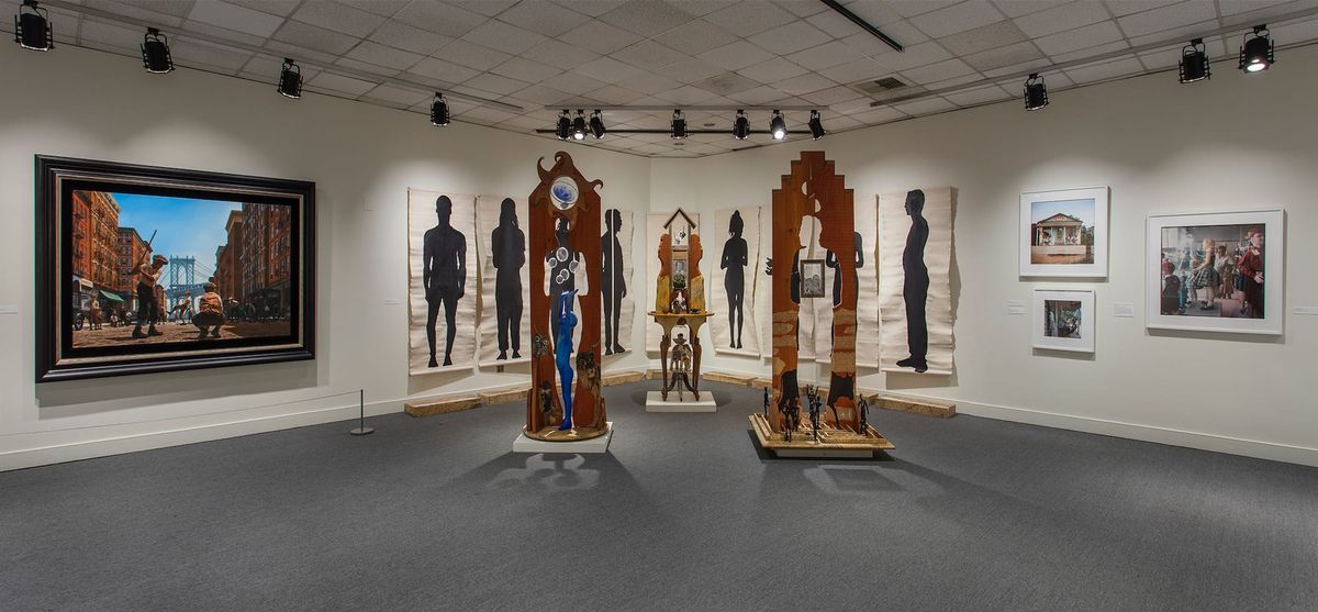 Installation view of sculptures and large-scale ink on paper works