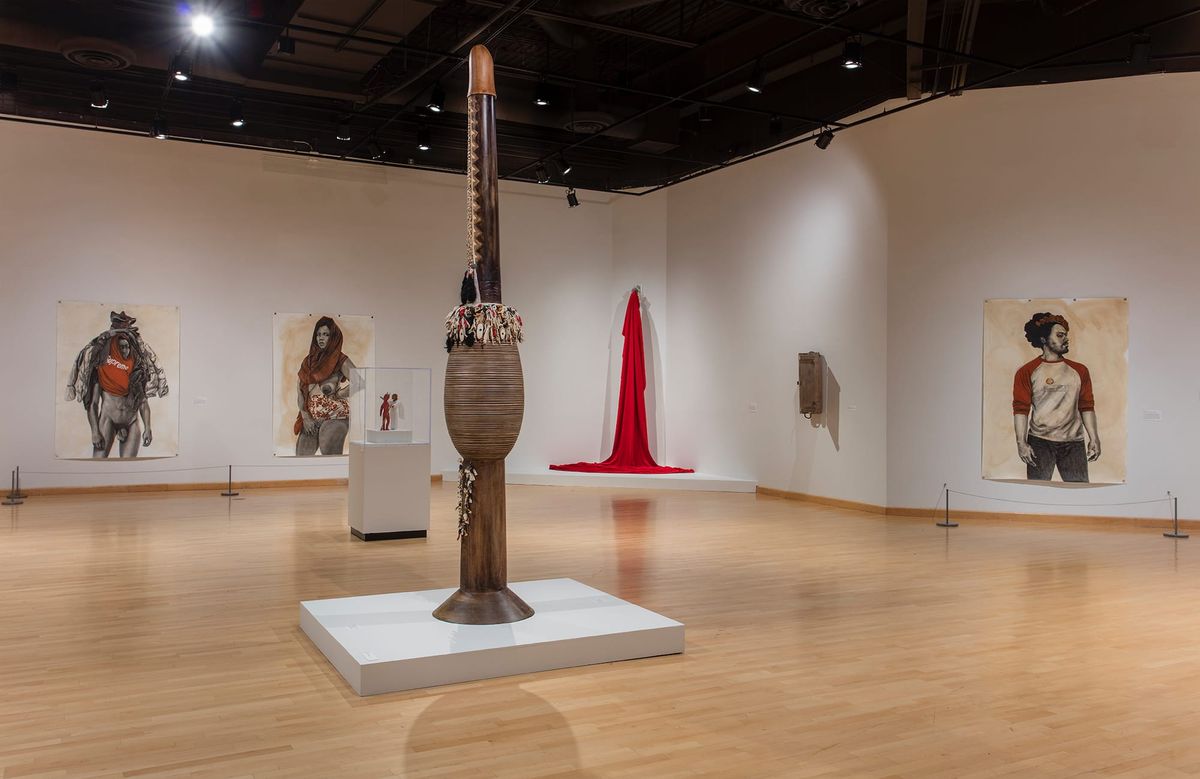 Installation view of gallery space with large scale paintings, sculpture, and installation