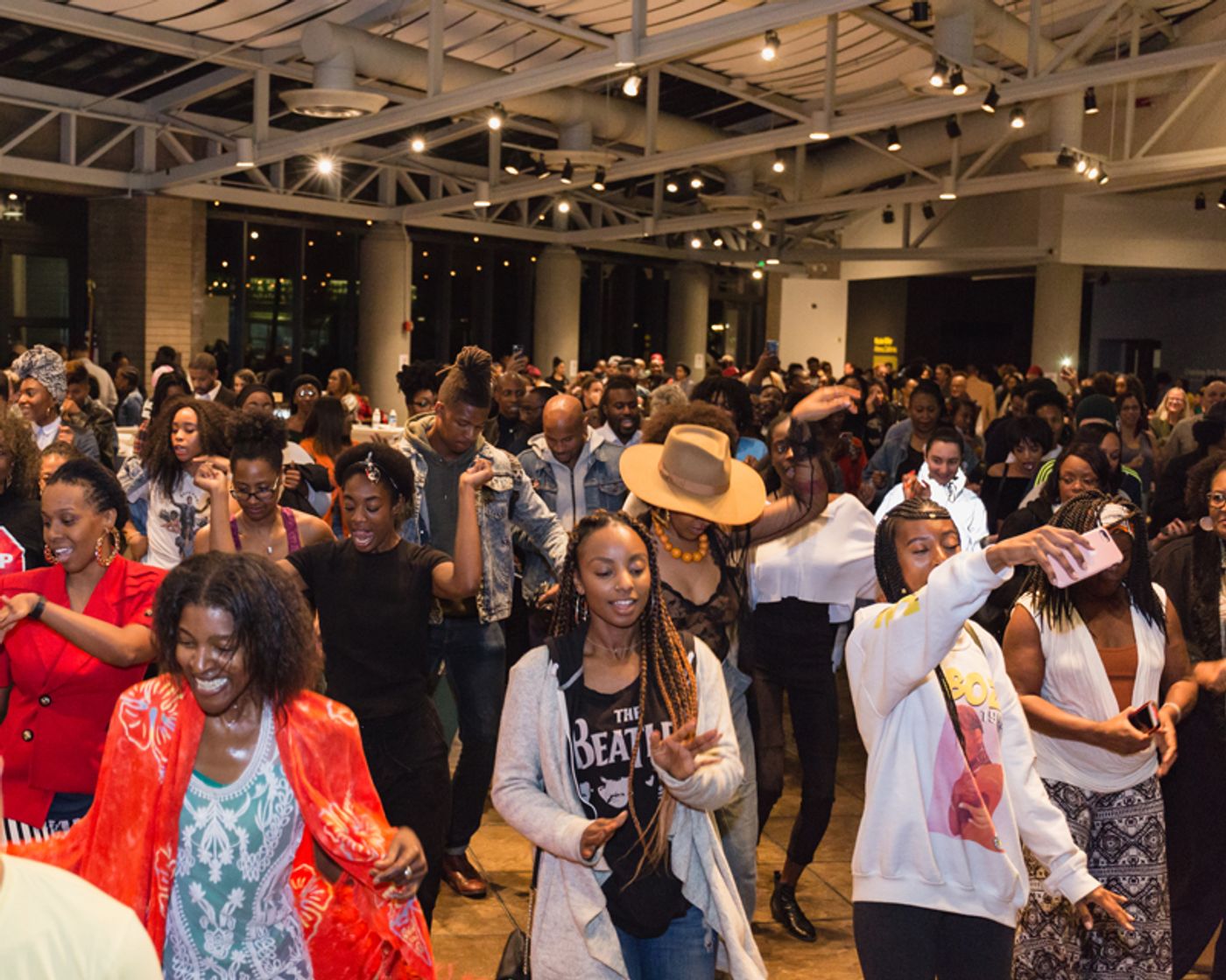 Auditorium full of guests dancing
