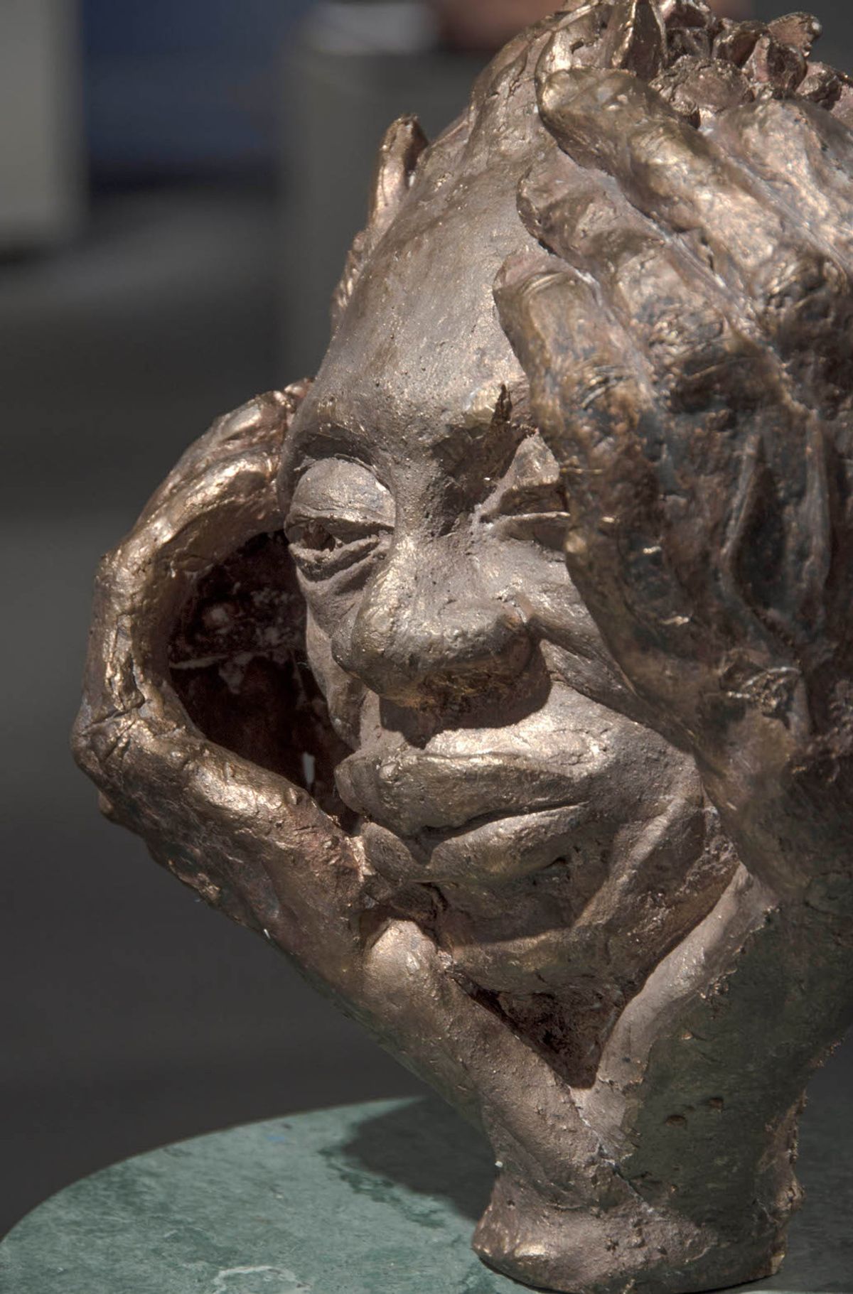 Bronze bust and hands