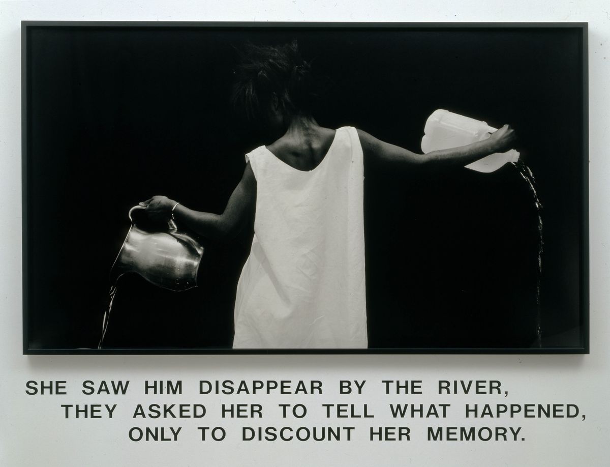 Story text underneath image of black woman in white dress pouring out water