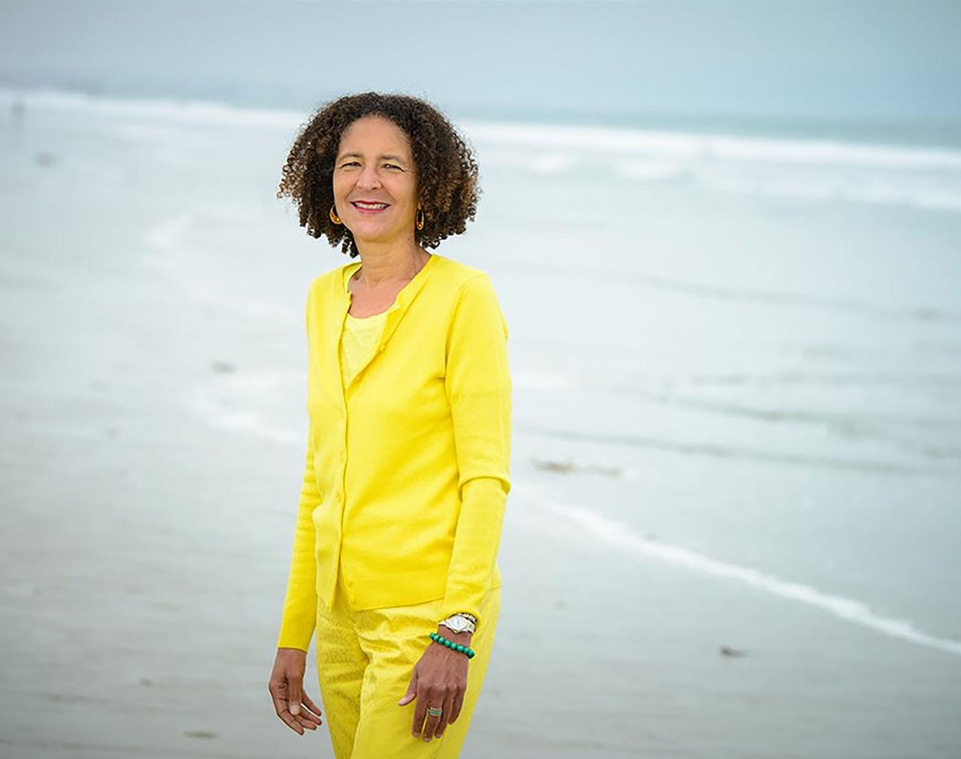 Alison Rose Jefferson standing at beach shoreline