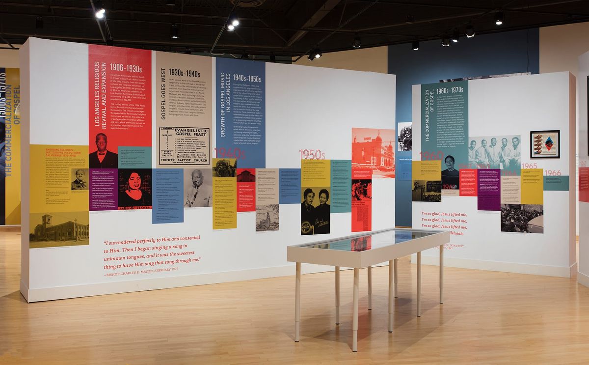 Installation view of photo patchwork and vitrine