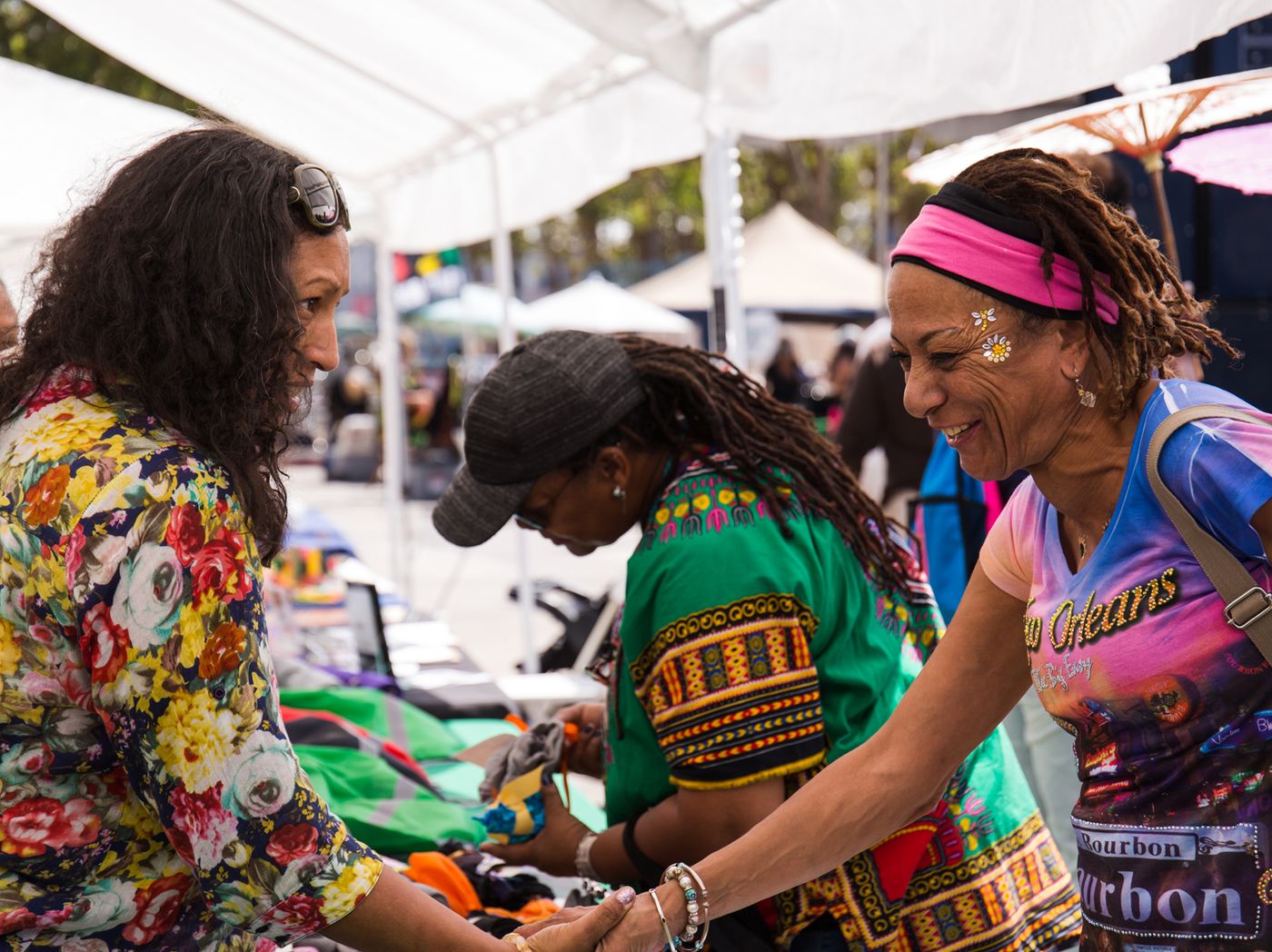 Vendors and customers talking at open air market