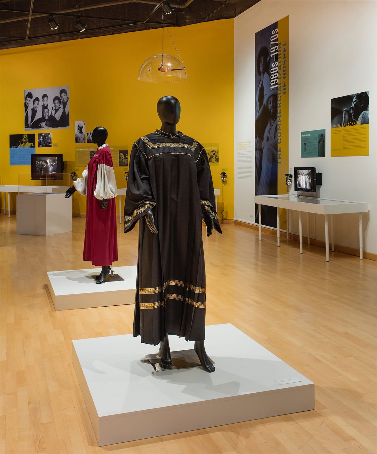 Installation view with focus on the choir robe displays