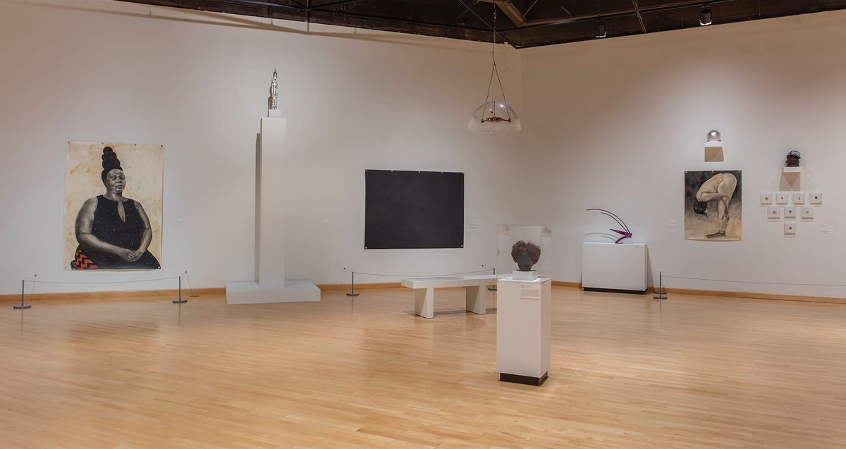 Installation view of paintings and sculptures