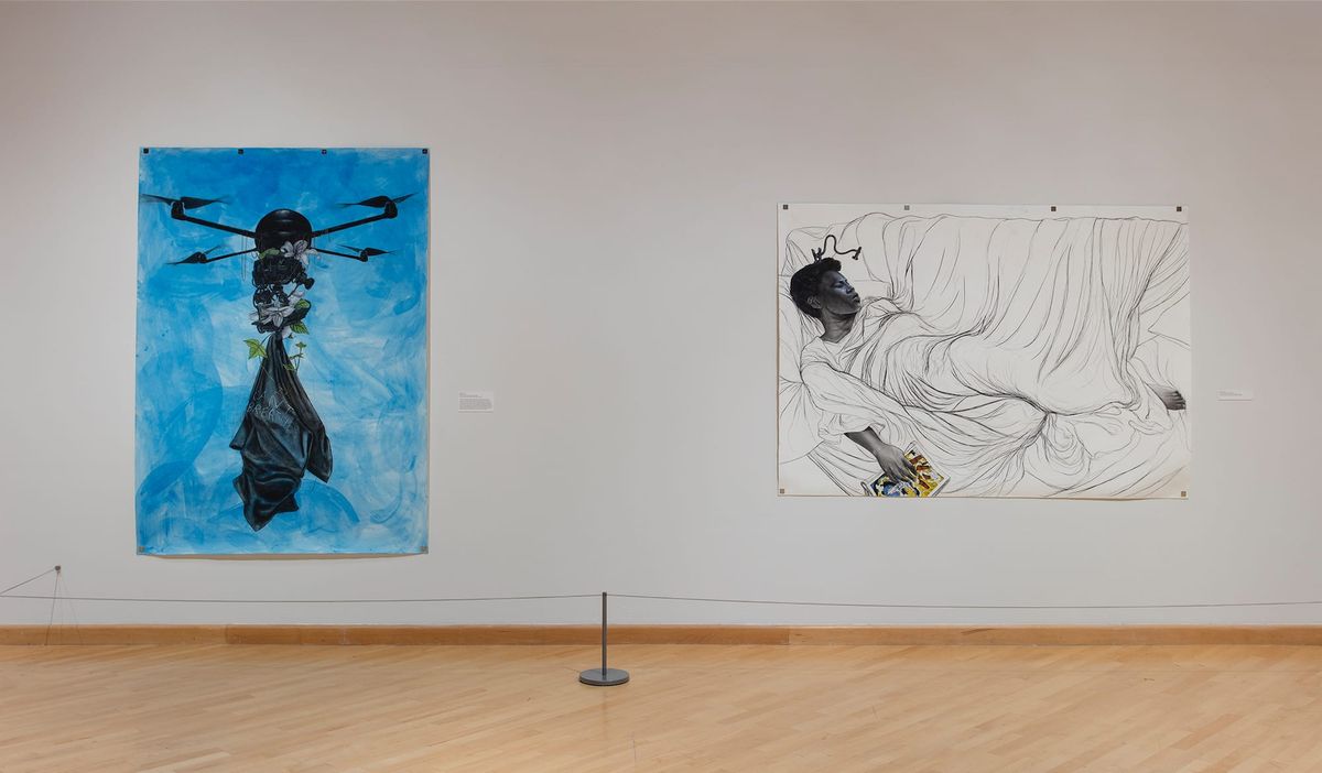 Two large paintings, one white, one awash in blue