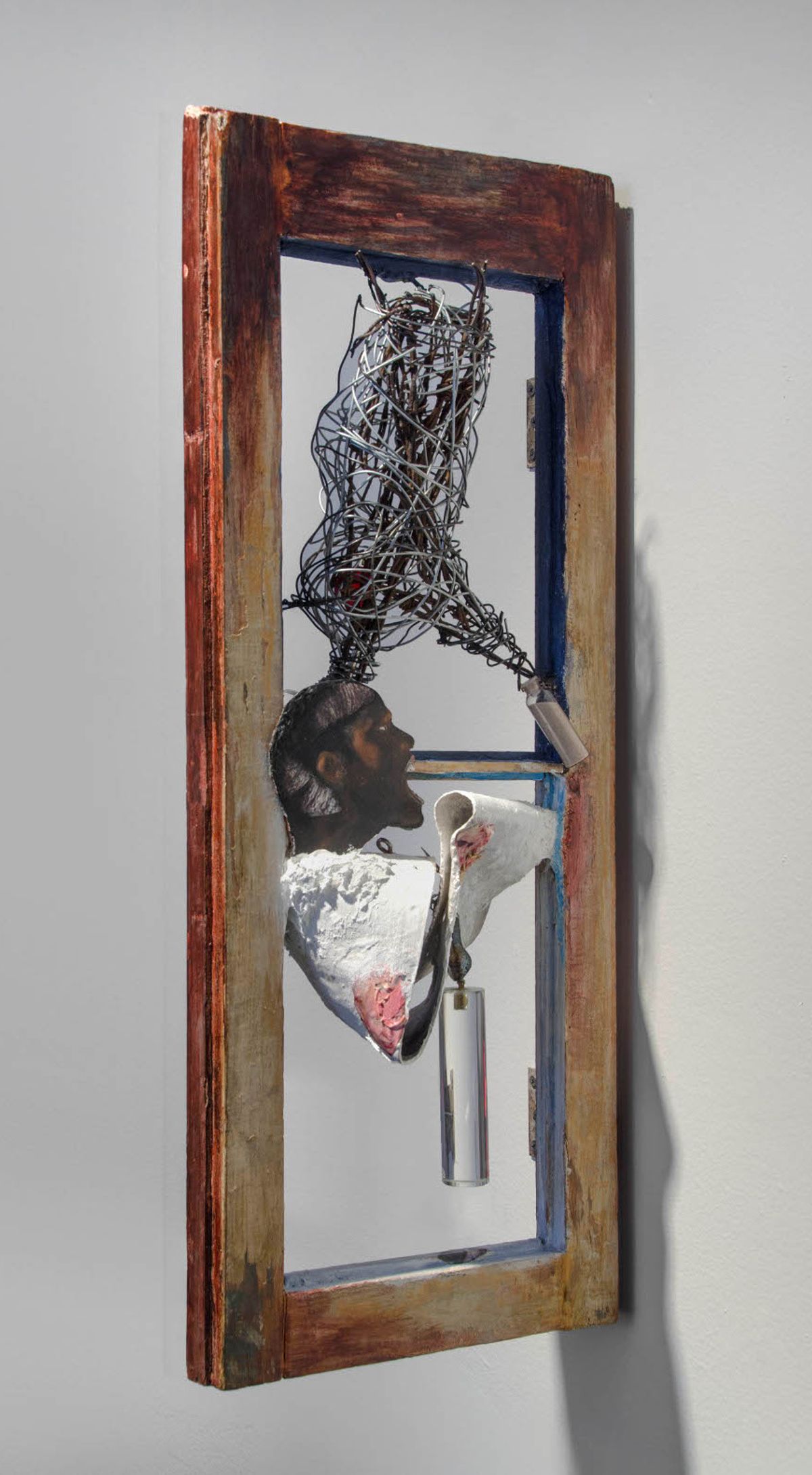 Mixed media collage set in vintage window frame
