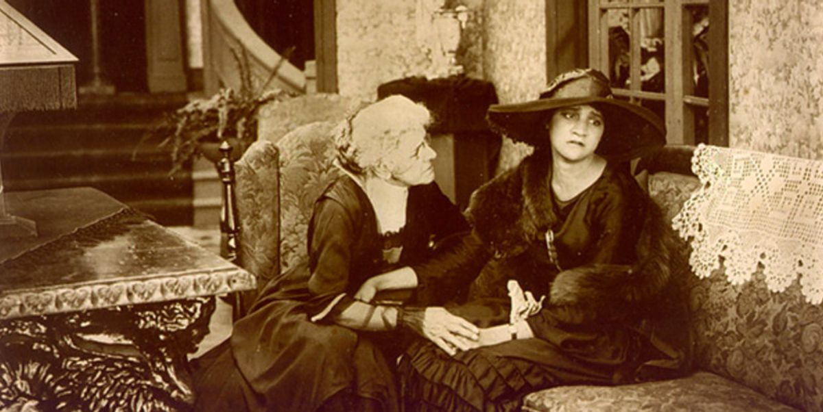 Sepia tone movie still two women in conversation