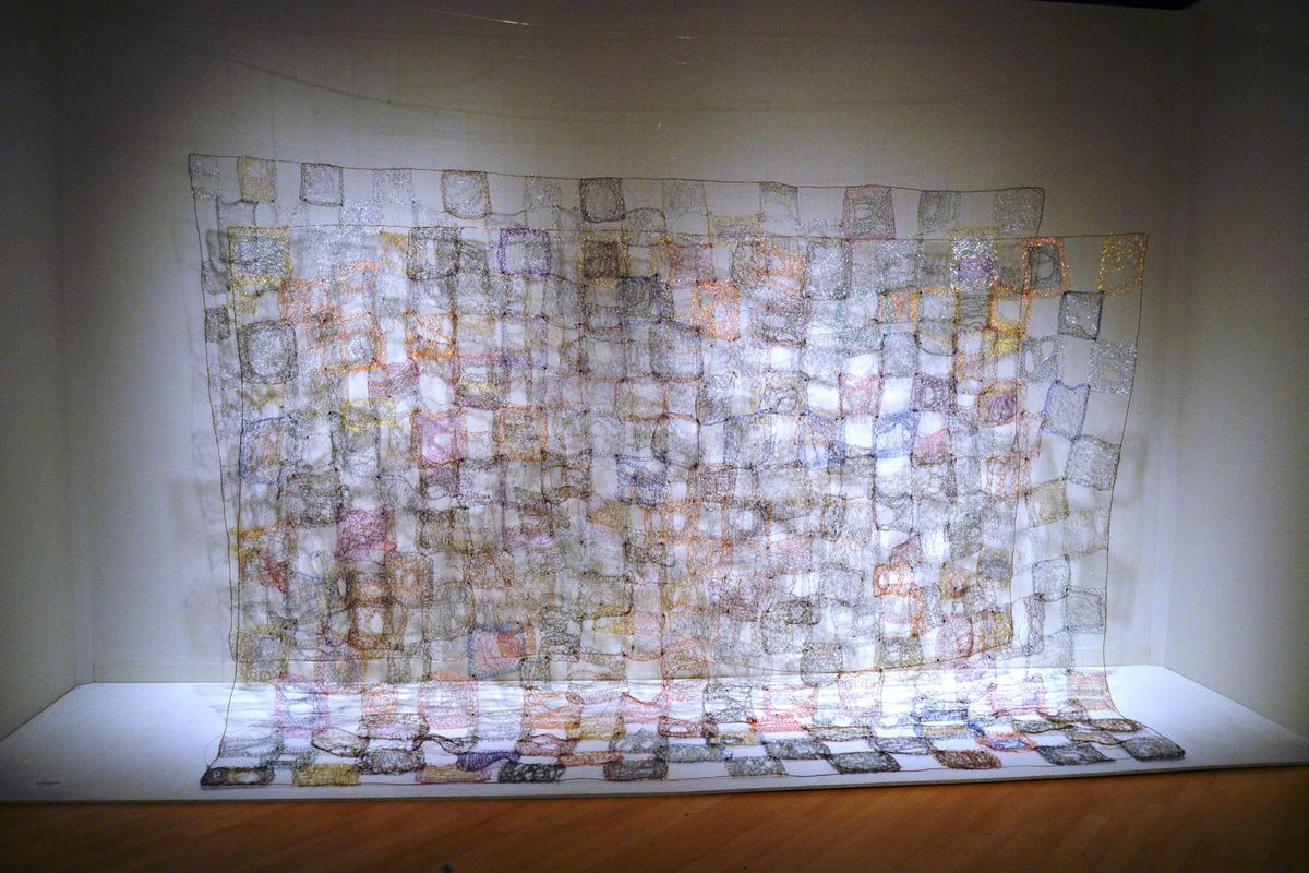 Large scale textile art,  patchwork of knitted panels