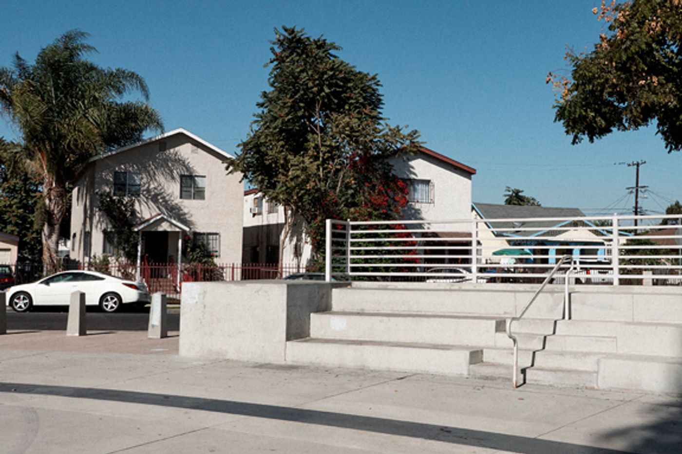 Street view of residences that face Watts Towers