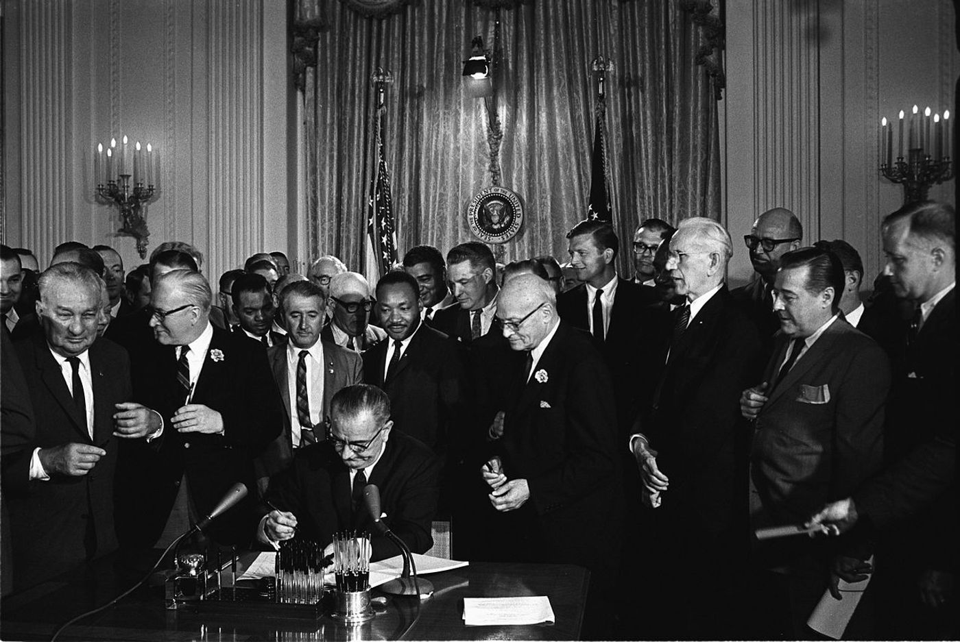 Group witnessing President Lyndon B. Johnson signs the 1964 Civil Rights Act