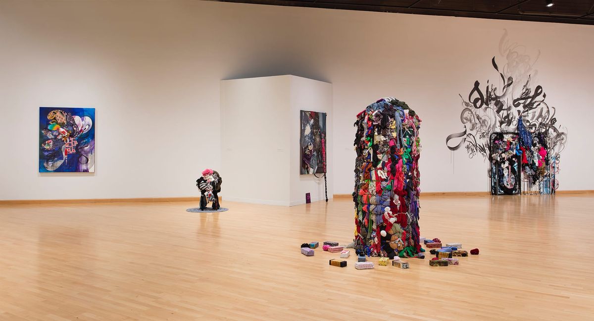 Installation view with focus on colorful and texturally dynamic sculptures of mixed media
