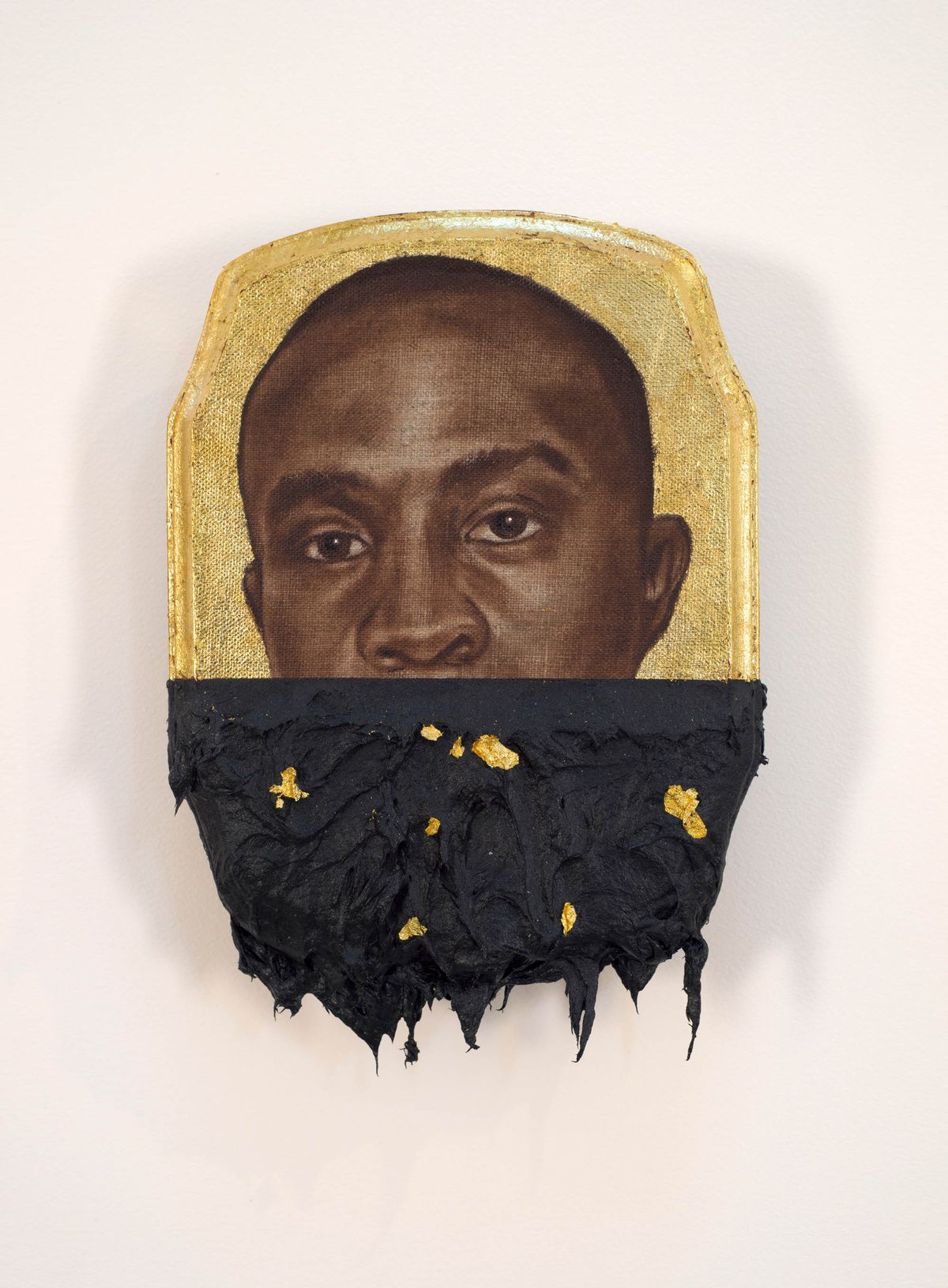 Face of black man with his mouth painted over with black all against gold leaf background