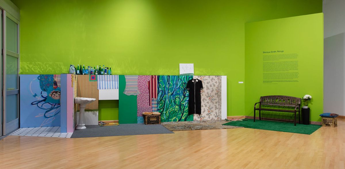 With green as a running theme through the installation this view includes green and blue  personal objects
