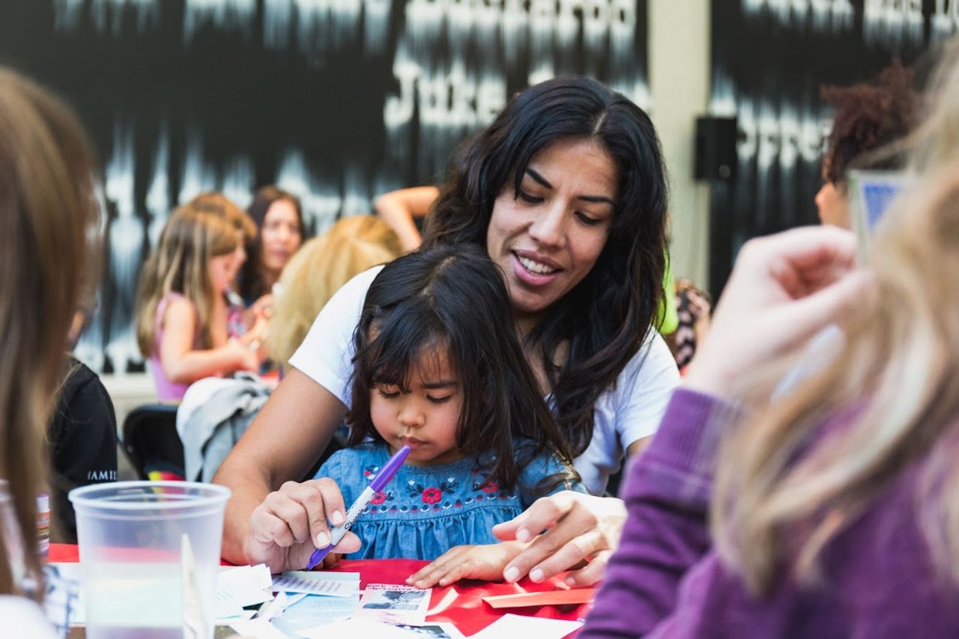Family participating in an zine workshop