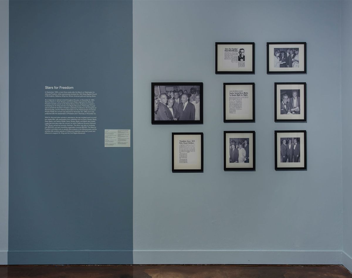 Installation view of photos and wall text