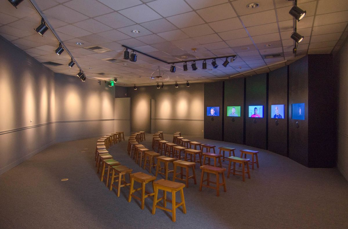 Screening room view of multi-monitor installation theater