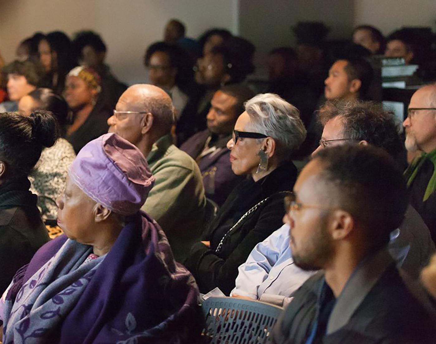 visitors attending a program