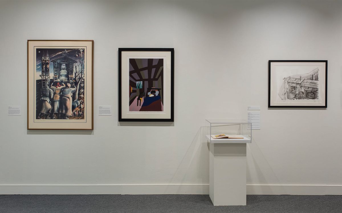 Installation view of photographs and vitrine