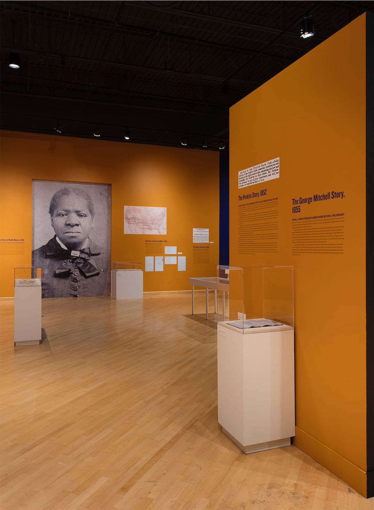 Installation view with large scale image of Biddy Mason