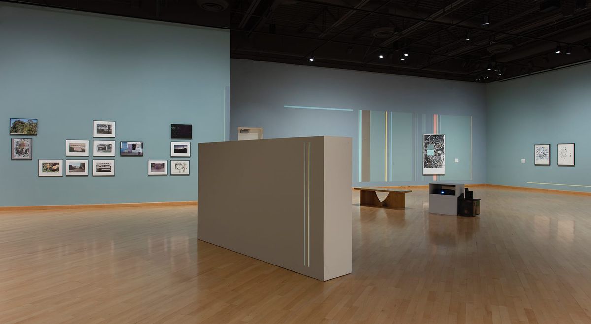 Far view of gallery space and artwork by Guerrier