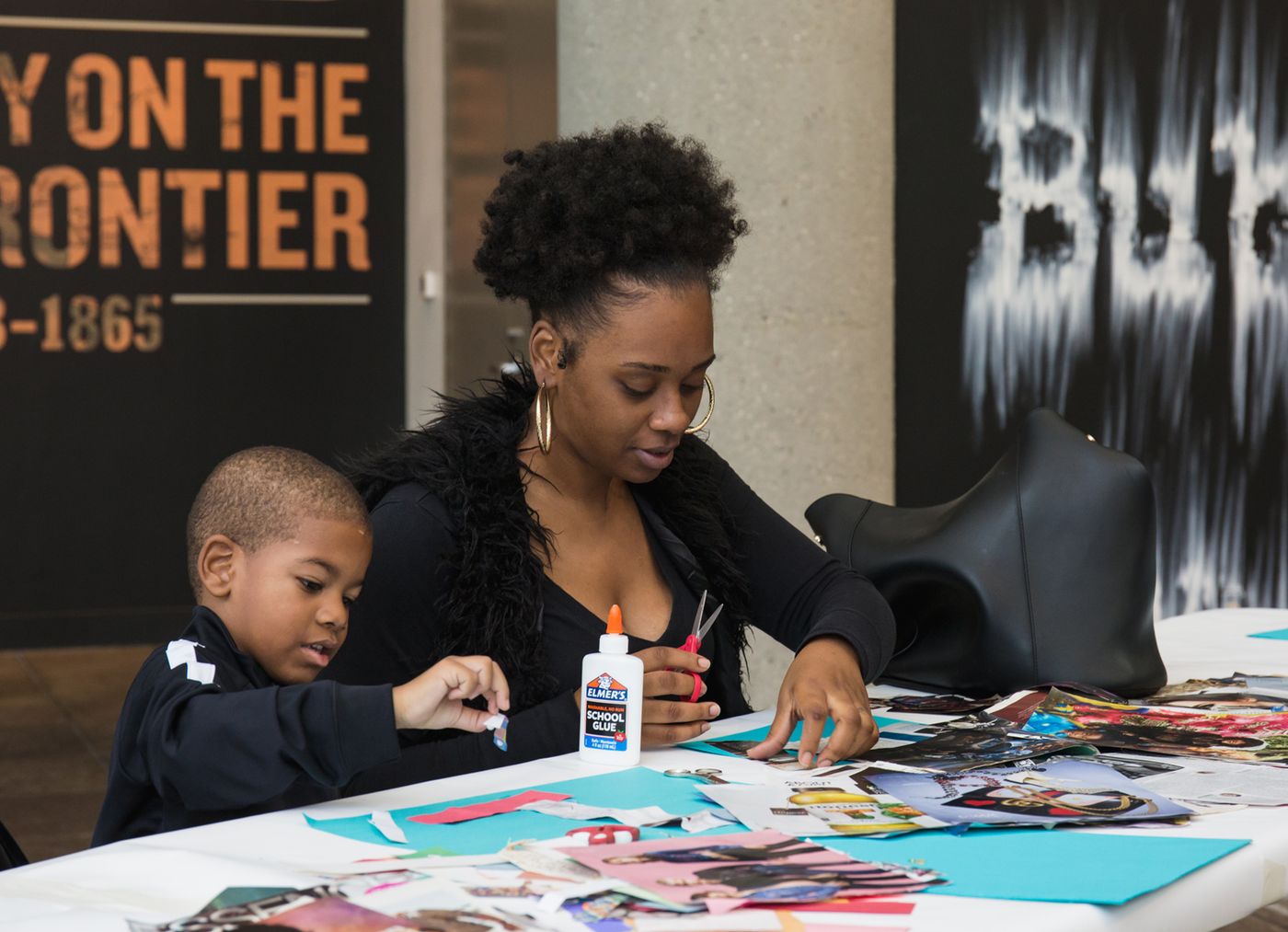 Family participating in an art workshop