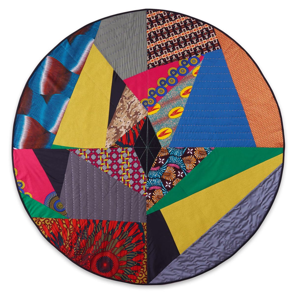 Assemblage of textiles; different colors and textures in circular frame