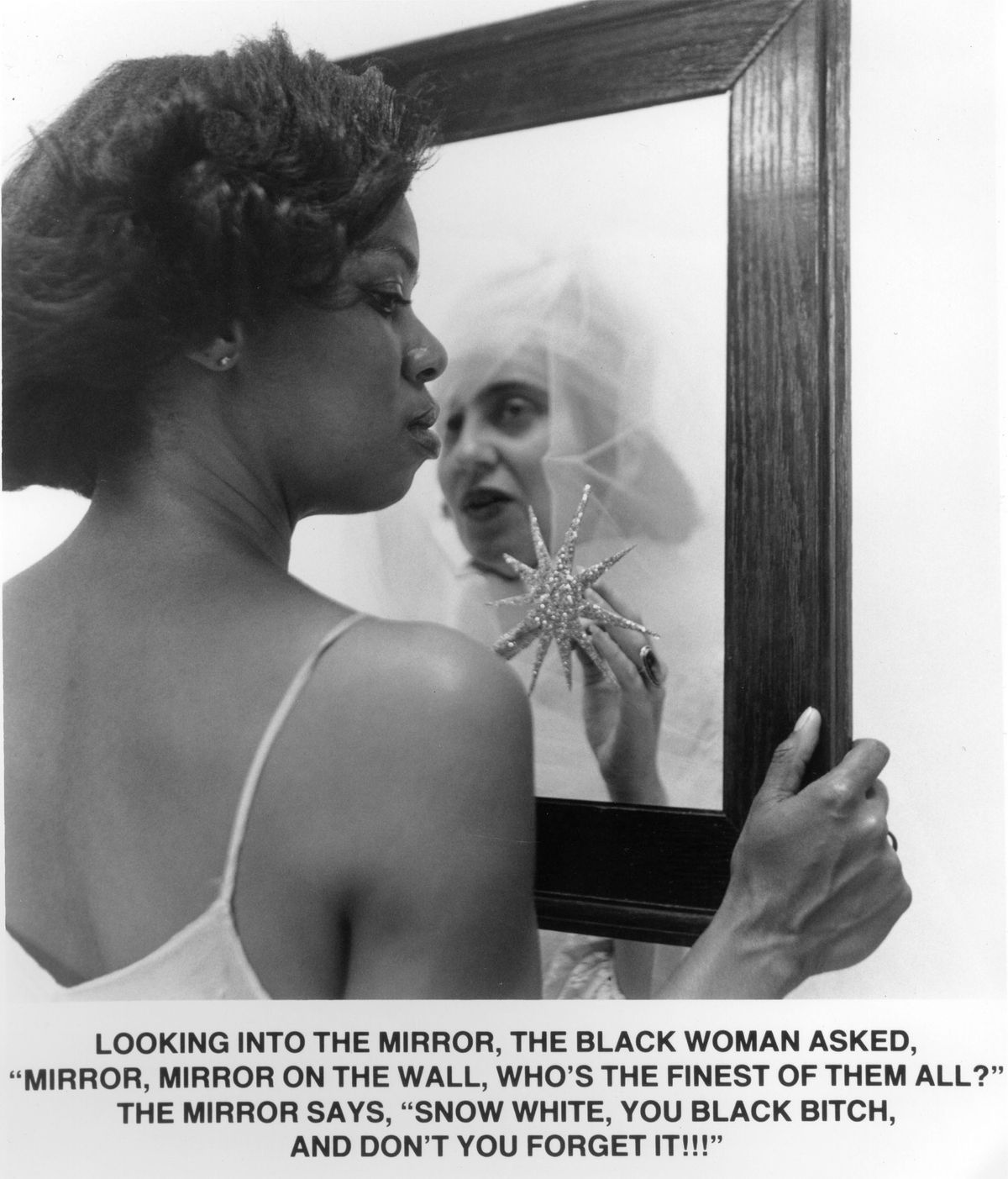 A brown skinned black woman looking into mirror to see it's spirit is a very light skinned black woman