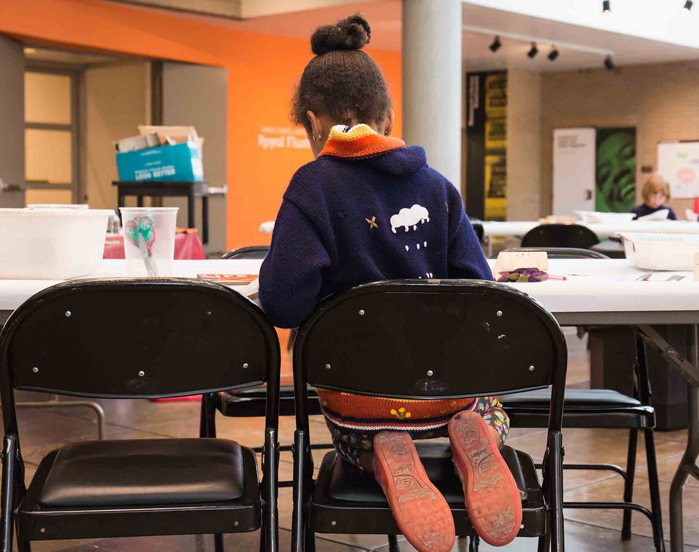 Child participating in an art workshop