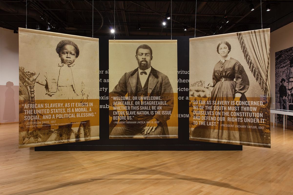 Installation view of large scale images of freedmen and freedwomen