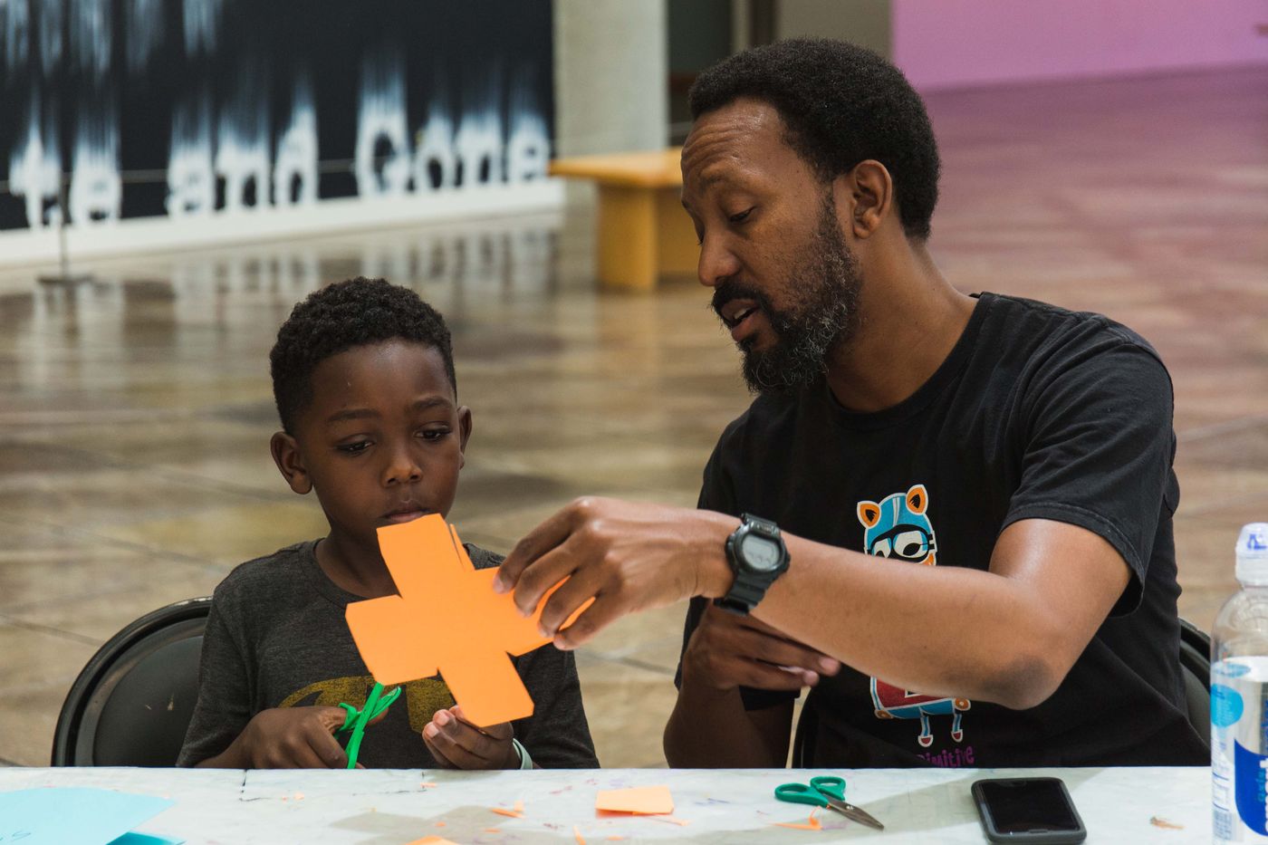 Family participating in an art workshop
