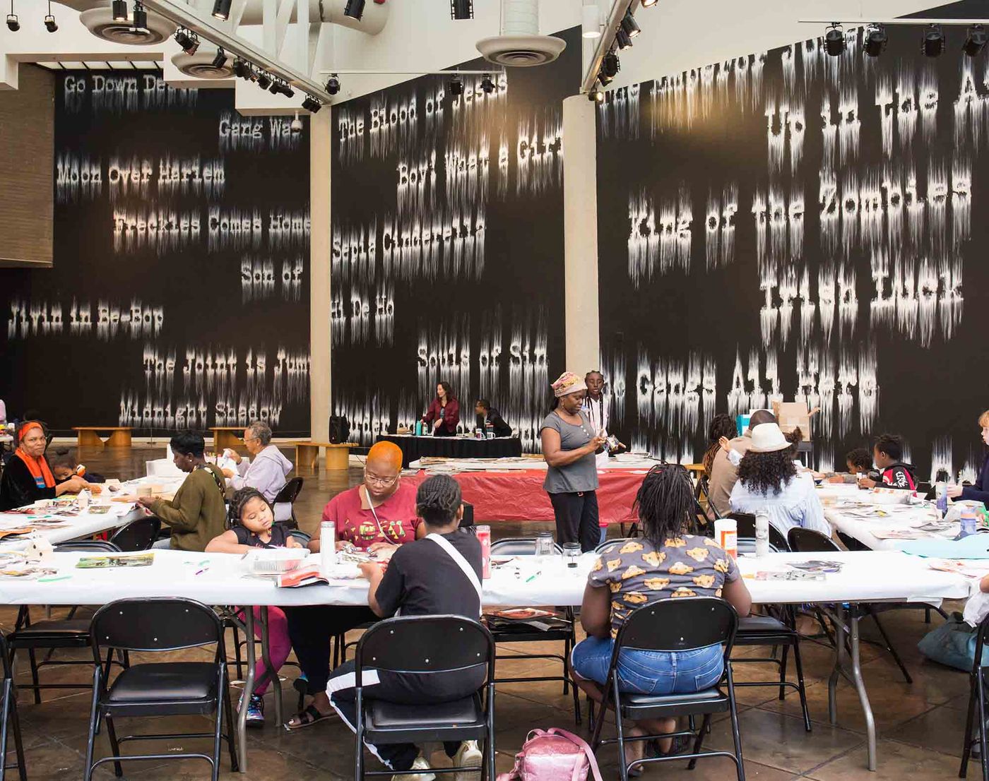 Families participating in an art workshop in the "Can't Stop, Won't Stop" Installation
