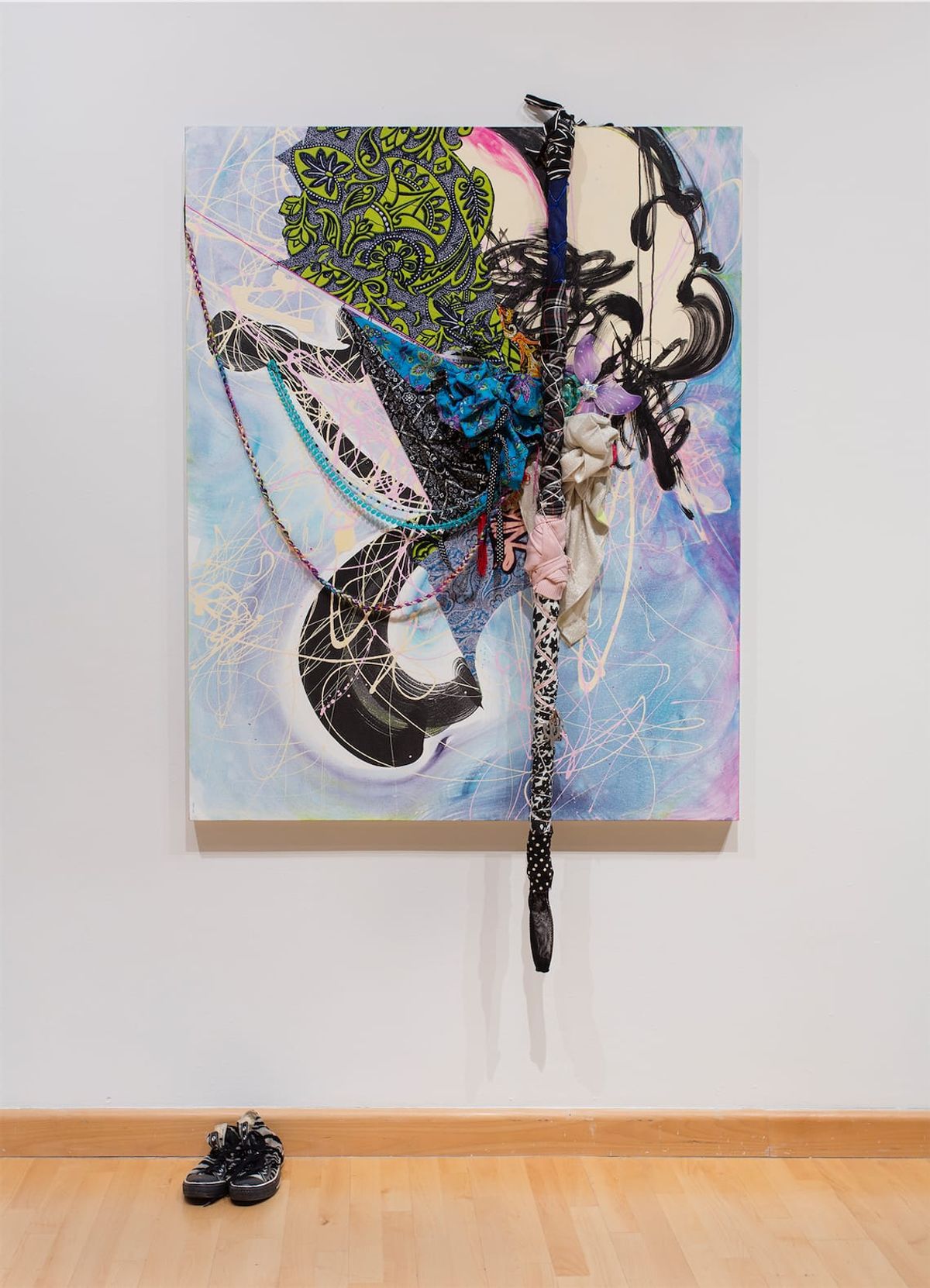 Installation view mixed media painting with shoes below