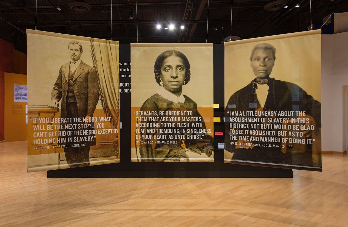 Installation view of large scale images of freedmen and freedwomen