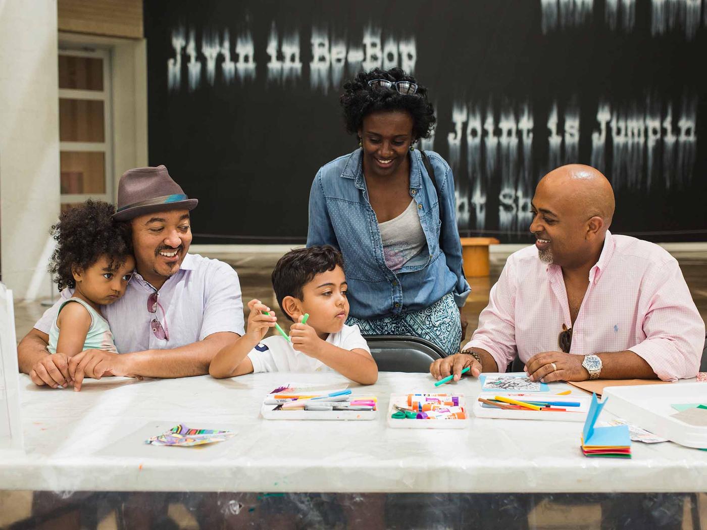 Families enjoying an art workshop