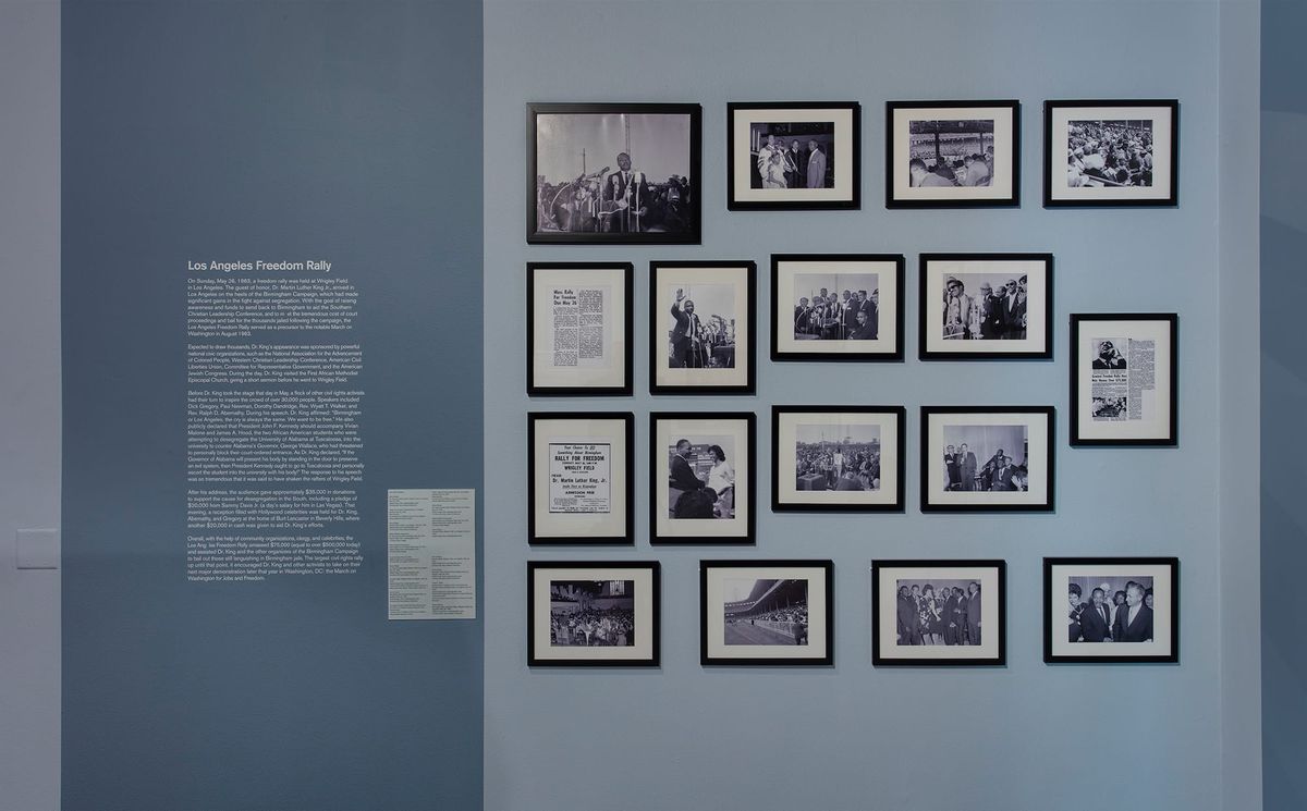 Installation view of wall text and photos