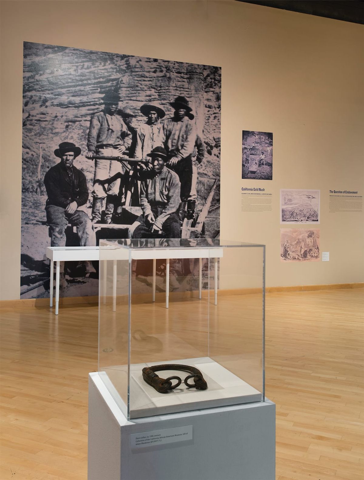 Installation view, the California gold rush enslaved men and boys with their enslaver