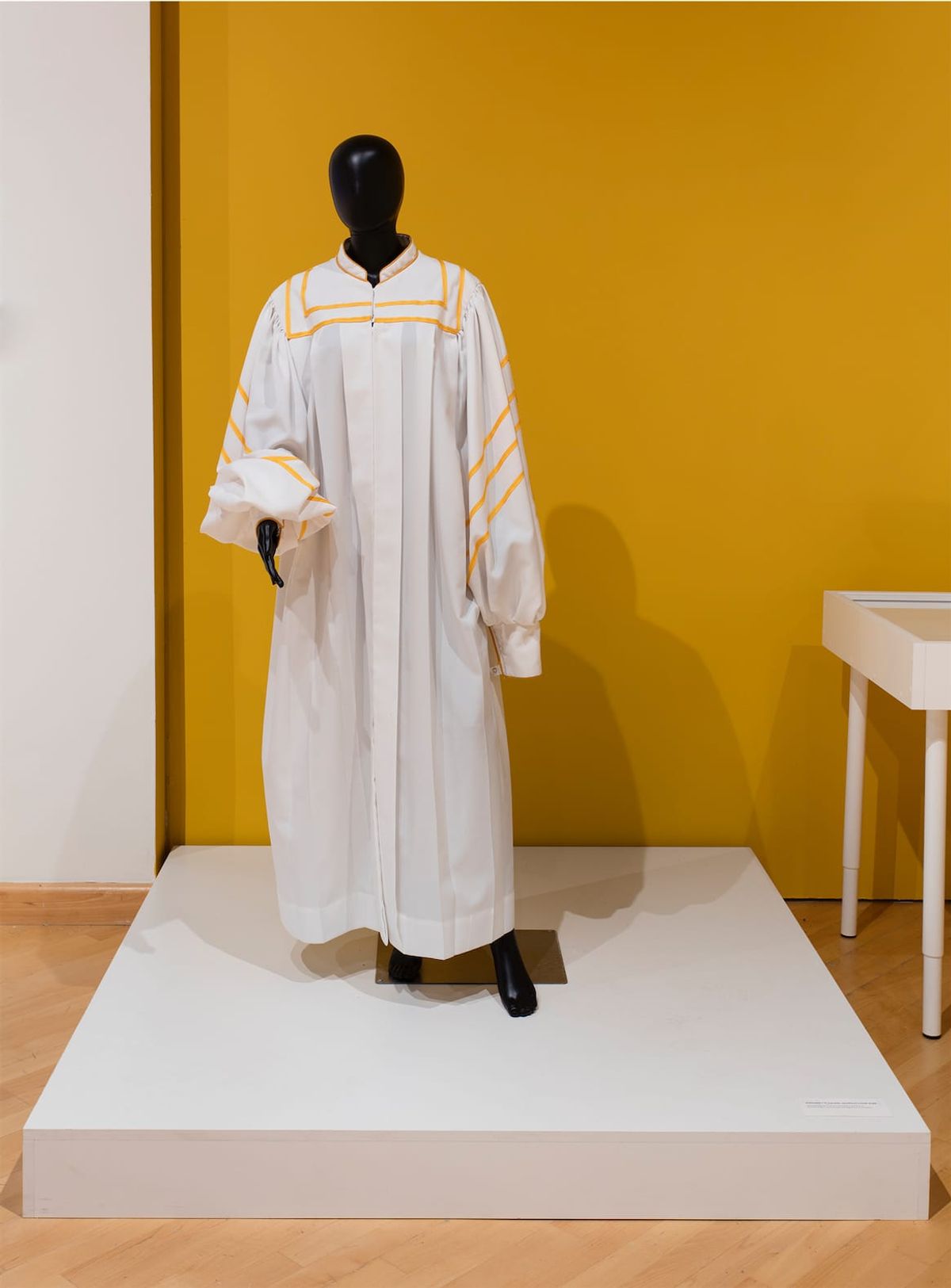 Installation view with focus on the choir robe display