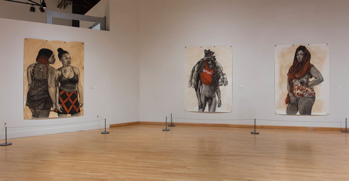 Installation view of three large scale paintings of people dressed for summer