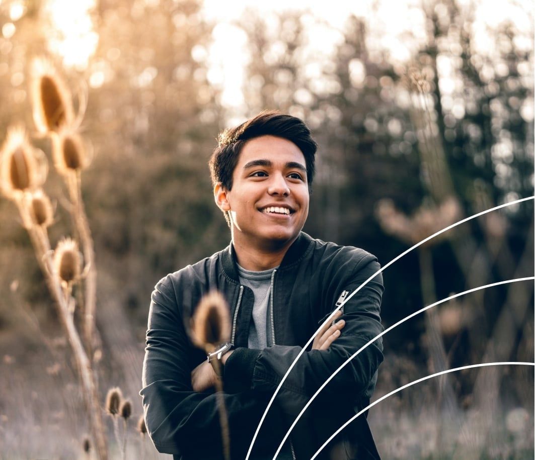 person standing in tall grass