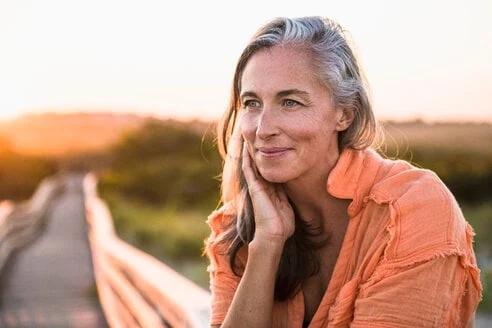 Boldin member smiling outdoors at sunset