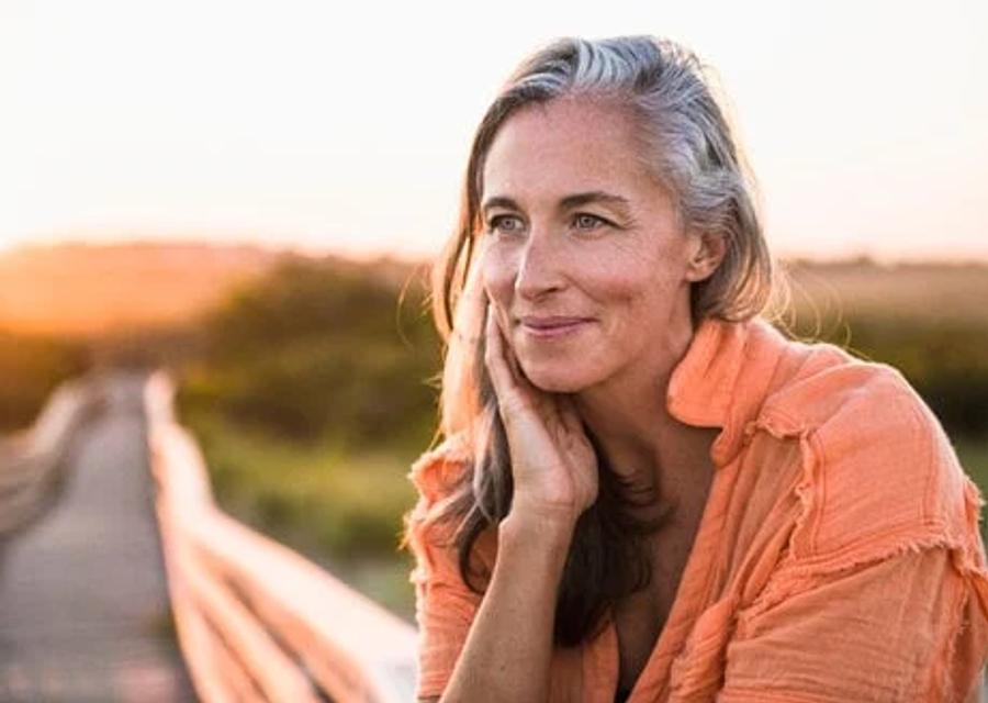 Boldin member smiling outdoors at sunset