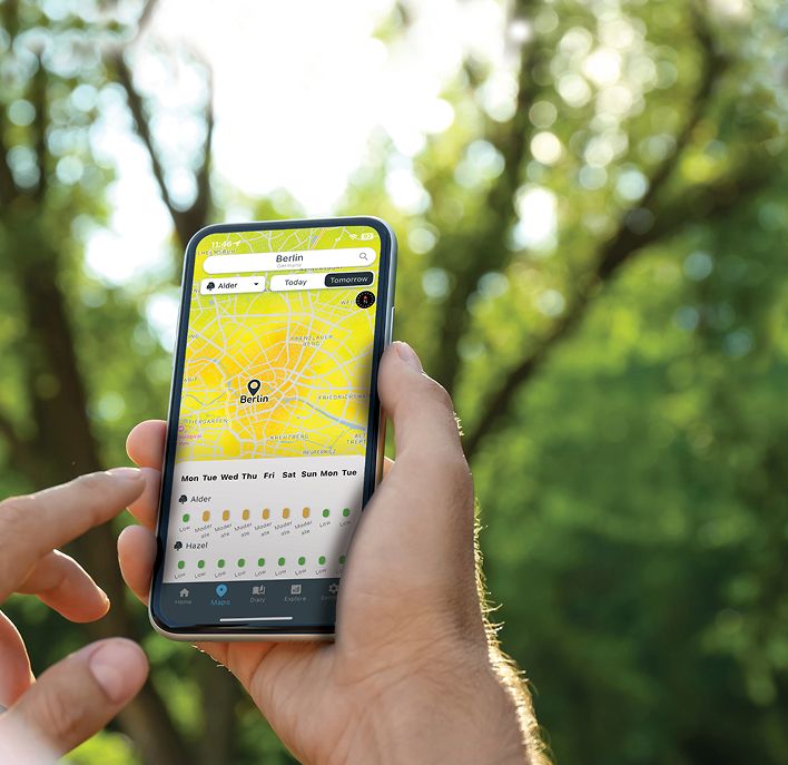 Hand showing the Airmine Pollen app