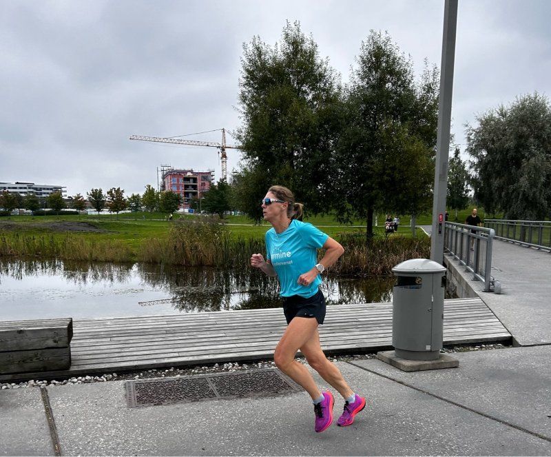 Kristin running in Airmine t-shirt
